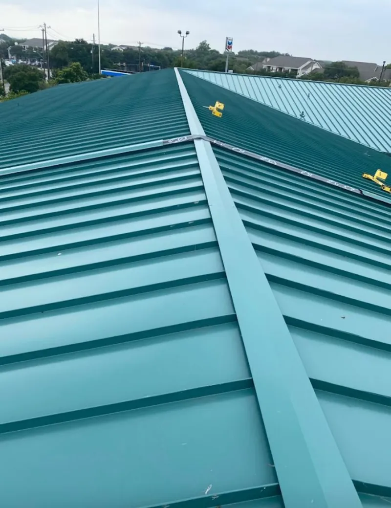 Green commercial metal roof ridge and valley for Metal Roof Repair in Castle Pines Village