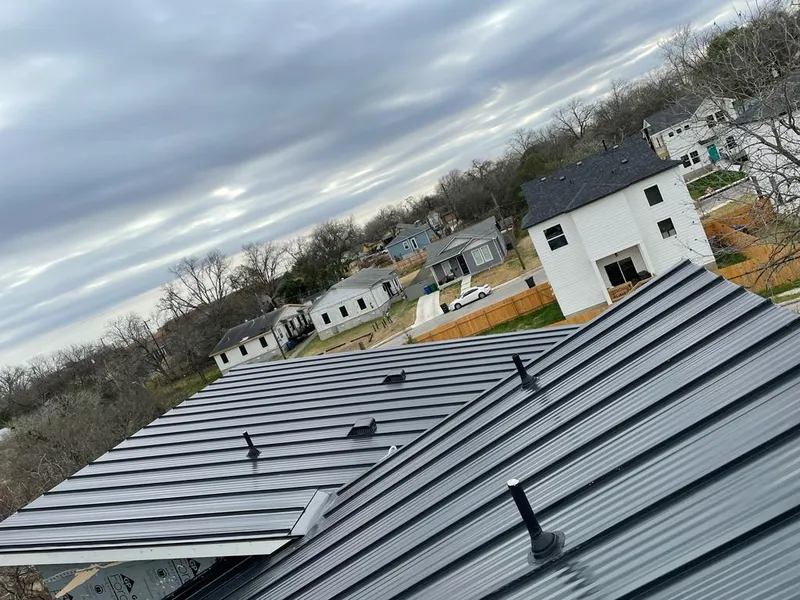 Standing seam metal roof panels with vents for Skylight Repair in Castle Pines Village